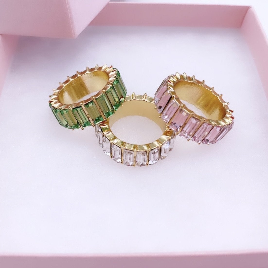 Pink, white and green AKA gold rings.