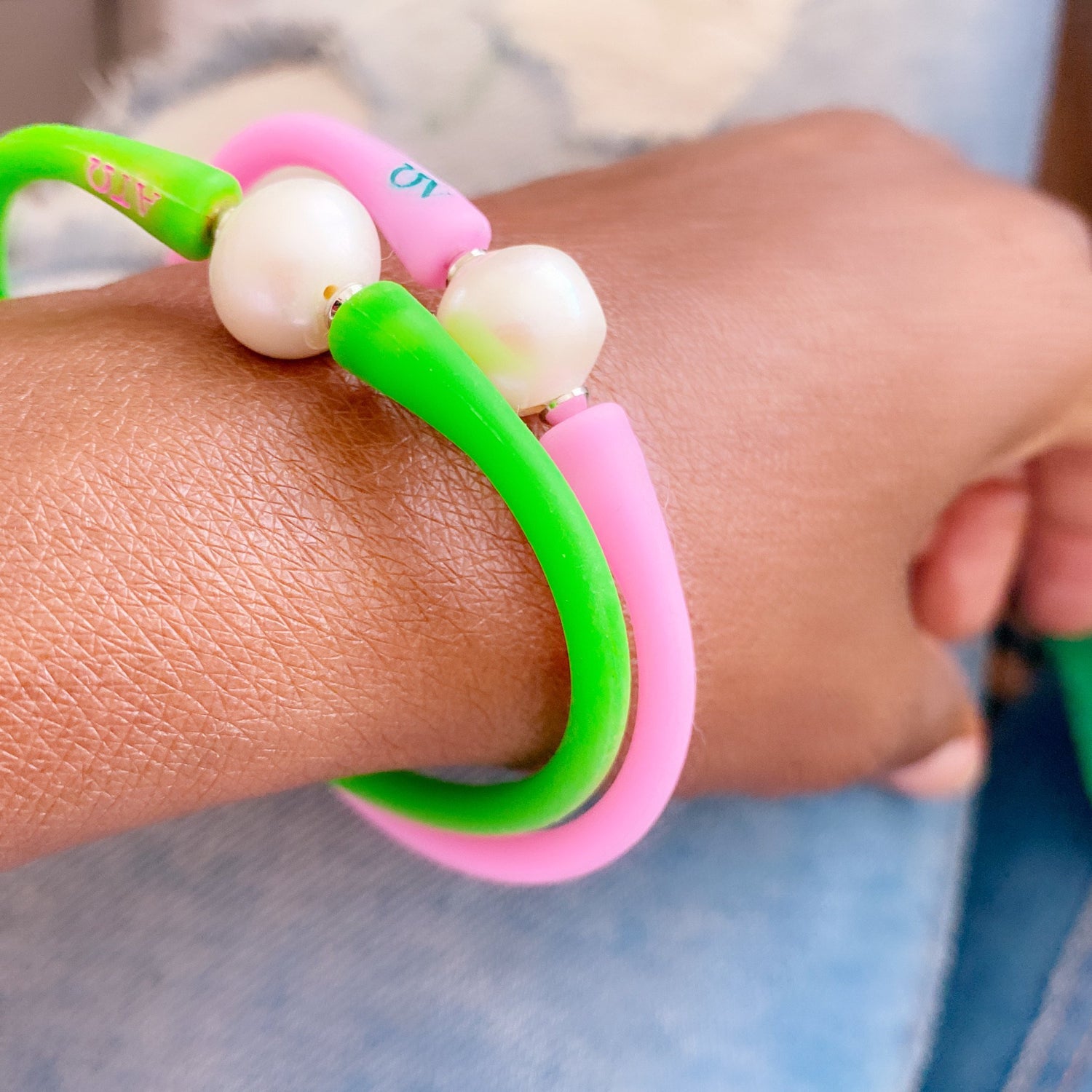 Pink and Green AKA bracelet with pearl clasp.