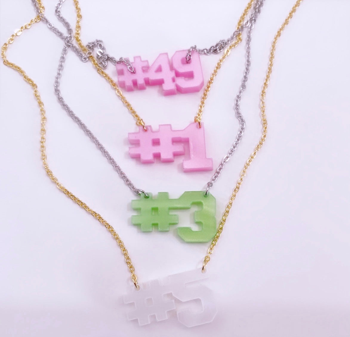 Order sorority inspired pink and green line number necklaces in bulk for sorority sisters.