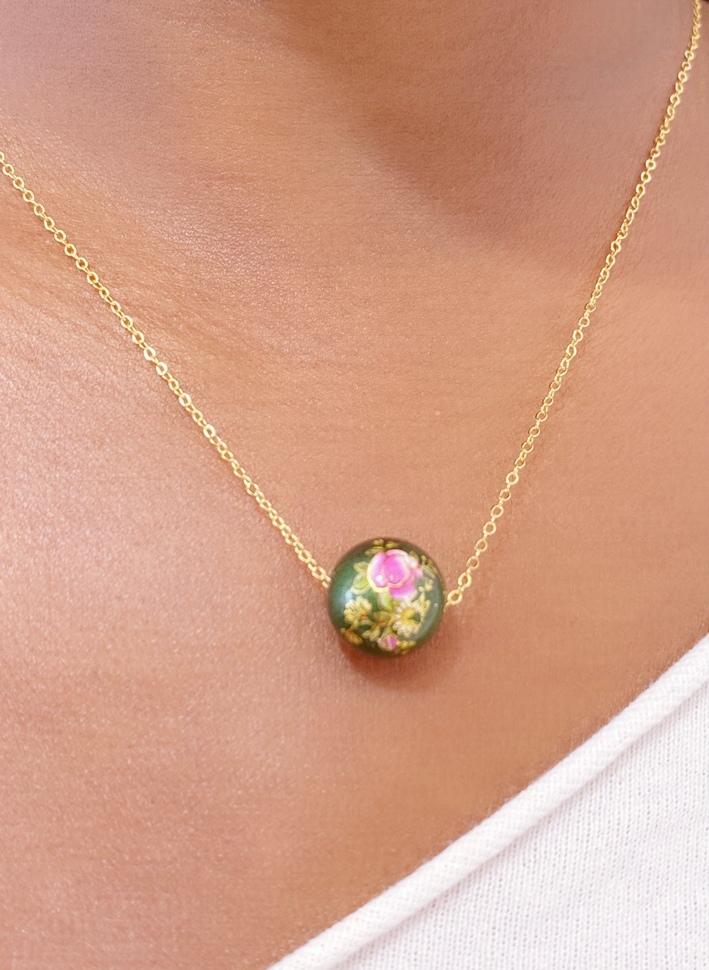 AKA soror wears The Chic Greek exclusive rose charm necklace.